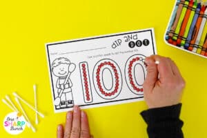 Celebrate the 100th Day of School with these no prep 100th day math activities for kindergarten and first grade! Students will practice counting to 100, making groups of 10, weighing 100 objects, comparing lengths, and more with these 100th Day centers. Your students will love making their own 100th day necklace, 100th day gumball craft, and 100th day crown. These 100th day math stations and 100th day of School activities can be done independently, with a small group, or as a whole group.