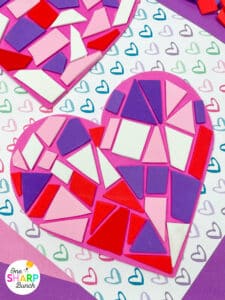 Add this Valentine’s mosaic heart craft to your list of Valentine’s party activities! This Valentine’s Day craft is a great opportunity to enhance fine motor skills as your students glue shapes to their foam hearts. This mosaic heart craft is perfect for your Valentine’s centers during your classroom Valentine’s Day party in preschool, kindergarten, or first grade. Plus, this craft for Valentine’s Day makes a cute Valentine’s bulletin board!