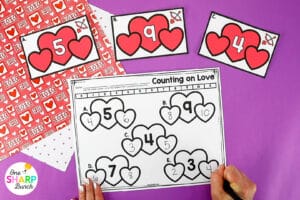 Celebrate Valentine’s Day, as you review math and literacy skills, with these engaging Valentine’s Day centers for kindergarten and first grade. These Valentine’s Day Escape Room activities can be used for a classroom Valentine’s Party or Valentine’s math and literacy centers. Students will practice syllables, beginning digraphs, decomposing numbers, 3D shapes, and more with these Valentine's Day activities. They will love these Valentine’s Day math centers and Valentine’s Day literacy centers!