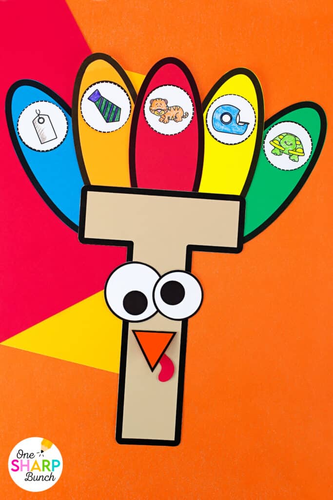 Reinforce beginning sounds while strengthening fine motor skills with this adorable T is for Turkey craft and activities for preschool and kindergarten! Complete the T is for Turkey pocket chart sort before playing the beginning sound game as a literacy center. Then assemble the adorable T is for Turkey craft which is great for working on scissor cutting skills and gluing skills. Your students will love identifying beginning sounds with this Thanksgiving craft for kids!