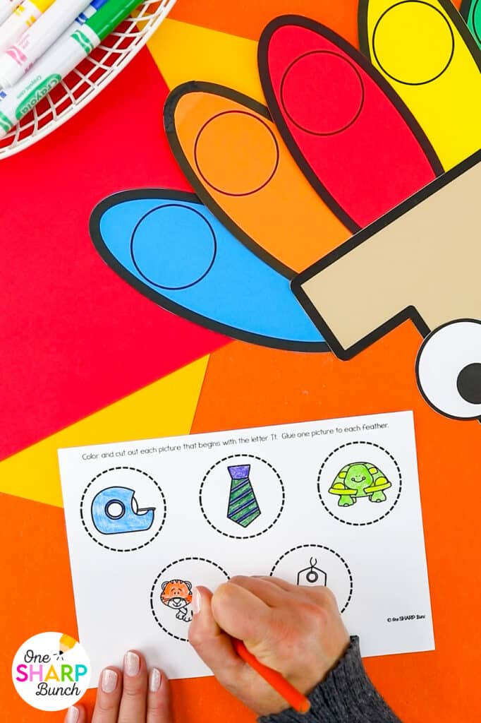 Reinforce beginning sounds while strengthening fine motor skills with this adorable T is for Turkey craft and activities for preschool and kindergarten! Complete the T is for Turkey pocket chart sort before playing the beginning sound game as a literacy center. Then assemble the adorable T is for Turkey craft which is great for working on scissor cutting skills and gluing skills. Your students will love identifying beginning sounds with this Thanksgiving craft for kids!