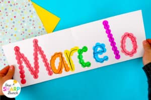 Strengthen fine motor skills while learning names during back to school with this simple bingo dauber name craft! This rainbow name craft is perfect for preschool and kindergarten name activities and name practice activities. Great back to school activities and back to school crafts, it also creates a bright back to school bulletin board. An easy name activity that doubles as engaging fine motor name activities for centers or small groups!