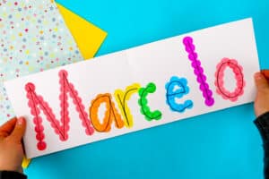 Strengthen fine motor skills while learning names during back to school with this simple bingo dauber name craft! This rainbow name craft is perfect for preschool and kindergarten name activities and name practice activities. Great back to school activities and back to school crafts, it also creates a bright back to school bulletin board. An easy name activity that doubles as engaging fine motor name activities for centers or small groups!