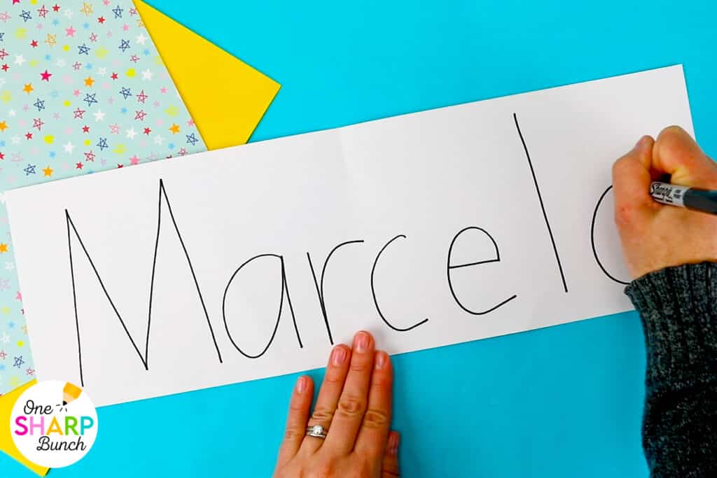 Strengthen fine motor skills while learning names during back to school with this simple bingo dauber name craft! This rainbow name craft is perfect for preschool and kindergarten name activities and name practice activities. Great back to school activities and back to school crafts, it also creates a bright back to school bulletin board. An easy name activity that doubles as engaging fine motor name activities for centers or small groups!