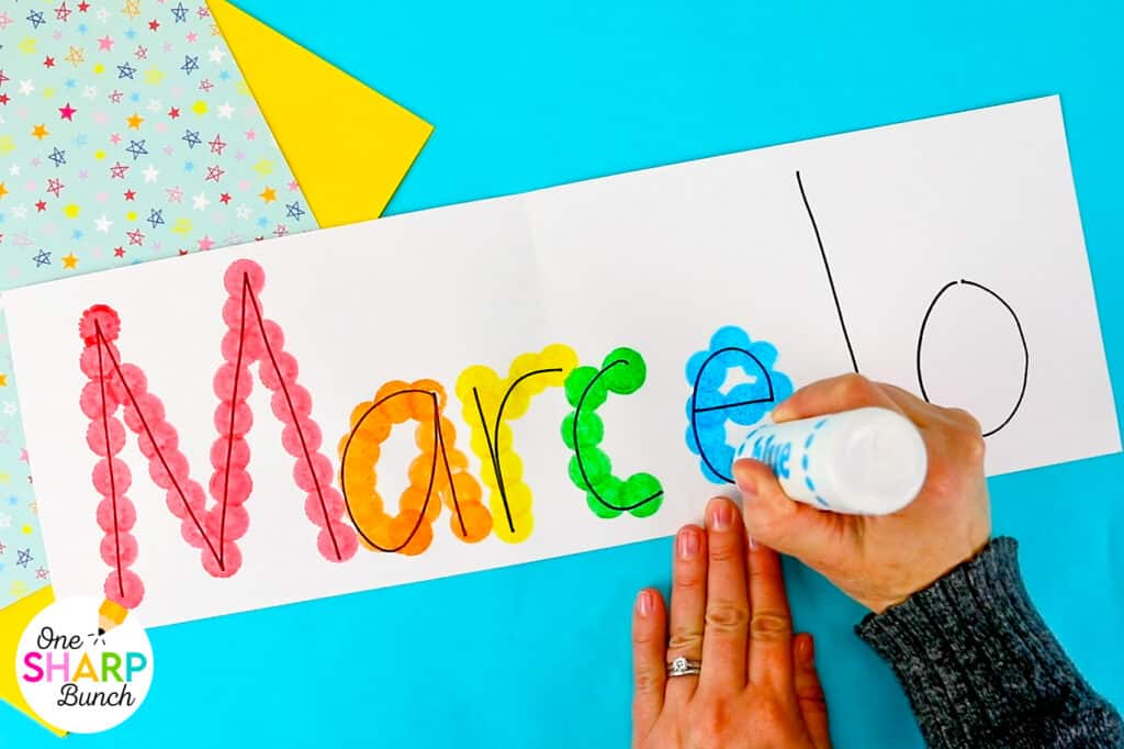Strengthen fine motor skills while learning names during back to school with this simple bingo dauber name craft! This rainbow name craft is perfect for preschool and kindergarten name activities and name practice activities. Great back to school activities and back to school crafts, it also creates a bright back to school bulletin board. An easy name activity that doubles as engaging fine motor name activities for centers or small groups!