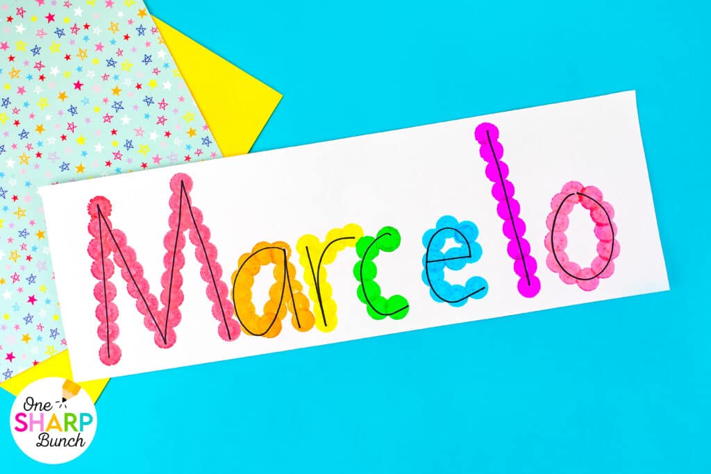Strengthen fine motor skills while learning names during back to school with this simple bingo dauber name craft! This rainbow name craft is perfect for preschool and kindergarten name activities and name practice activities. Great back to school activities and back to school crafts, it also creates a bright back to school bulletin board. An easy name activity that doubles as engaging fine motor name activities for centers or small groups!