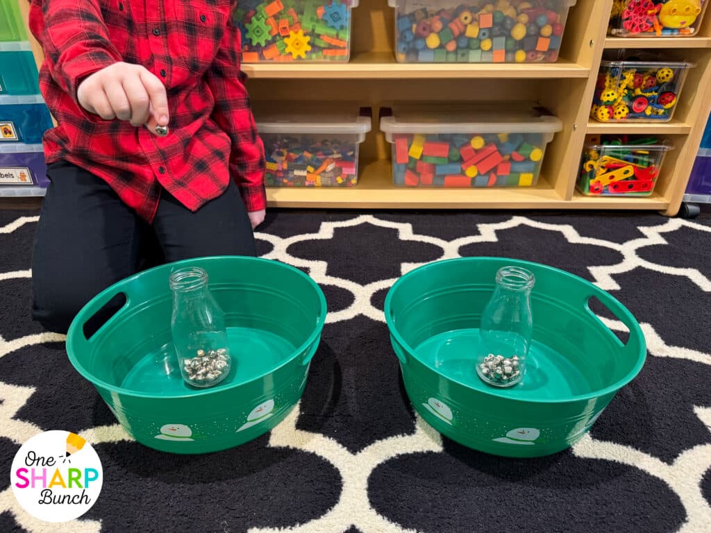 Throw an unforgettable classroom holiday party with these simple and inexpensive DIY Christmas party games for kids! These classroom winter party games include a snowman toss, snowman bowling, and jingle bell drop. All are great for strengthening fine motor skills while celebrating before winter break. Learn more about incorporating these classroom Christmas games for kids and Christmas activities into your classroom Christmas party stations!