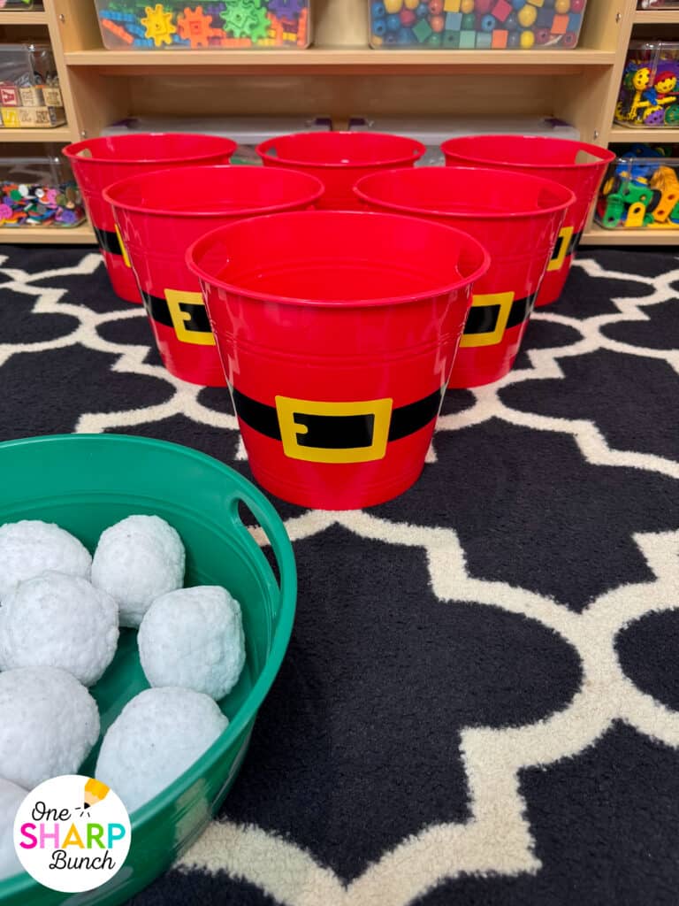 Throw an unforgettable classroom holiday party with these simple and inexpensive DIY Christmas party games for kids! These classroom winter party games include a snowman toss, snowman bowling, and jingle bell drop. All are great for strengthening fine motor skills while celebrating before winter break. Learn more about incorporating these classroom Christmas games for kids and Christmas activities into your classroom Christmas party stations!