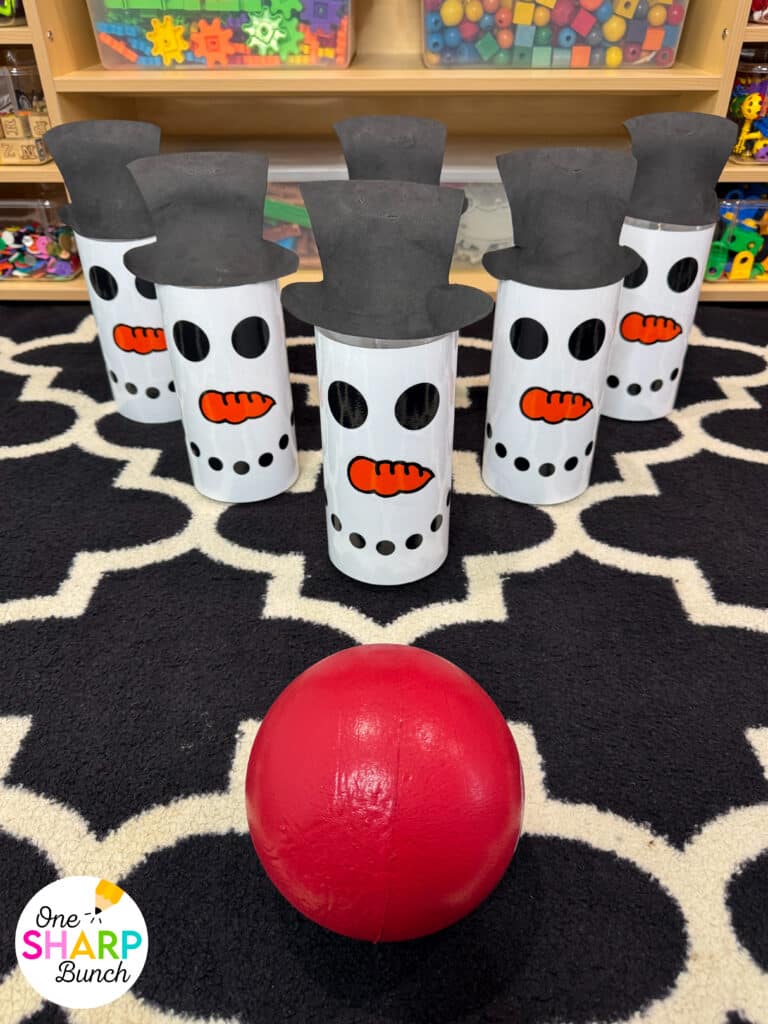Throw an unforgettable classroom holiday party with these simple and inexpensive DIY Christmas party games for kids! These classroom winter party games include a snowman toss, snowman bowling, and jingle bell drop. All are great for strengthening fine motor skills while celebrating before winter break. Learn more about incorporating these classroom Christmas games for kids and Christmas activities into your classroom Christmas party stations!